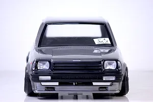 Front view of the Pandora RC Toyota Starlet KP61 RC body shell in grey and black against a plain white background.