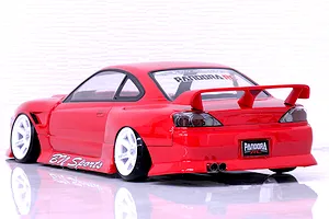 Rear three-quarter view of a red RC drift car body styled as an S15 Silvia with BN Sports kit and white wheels.