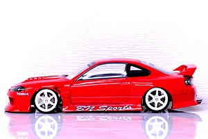 Side profile view of a painted red Pandora RC S15 Silvia BN Sports body shell on an RC car with white wheels against a white background.