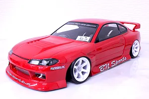 Red Pandora RC S15 Silvia BN Sports body shell mounted on an RC chassis with white wheels against a white background.