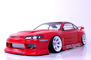Painted red Pandora RC S15 Silvia BN Sports body shell on an RC drift chassis with white wheels.