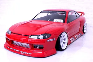 Red Pandora RC S15 Silvia BN Sports body shell on a drift chassis with white wheels against a white background.