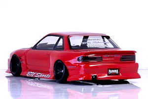 Rear-three-quarter view of a painted red Pandora RC S13 Silvia drift car body shell with BN Sports decals against a white studio background.