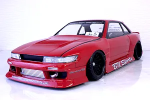 Red Pandora RC S13 Silvia drift car body shell with BN Sports decals, front mount intercooler, and black multi-spoke wheels on a reflective surface.