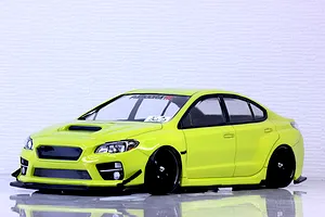 Bright lime green Subaru WRX STI RC drift car body shell mounted on a chassis with black multi-spoke wheels against a white wall.