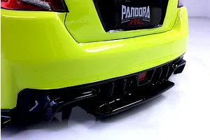 Close-up of the bright yellow rear bumper and black diffuser on a Pandora RC Subaru WRX STI body shell.