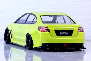 Rear-three-quarter view of a bright yellow RC drift car body shell representing a Subaru WRX STI with black wheels and aggressive body kit.