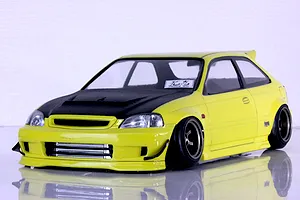 Yellow Honda Civic EK9 RC drift car body with carbon fiber hood and deep dish wheels on a reflective white studio surface.