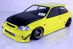 Painted yellow RC drift car body shell styled as a Honda Civic EK9 with carbon-effect hood and black wheels on a white surface.