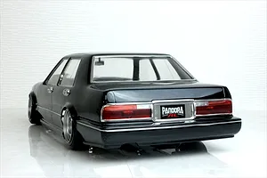 Rear three-quarter view of a black Pandora RC Y31 Cedric sedan body shell with detailed tail lights and chrome trim.