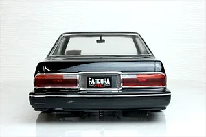 Rear view of the Pandora RC Y31 Cedric Sedan body shell painted black, showing tail lights and brand license plate.
