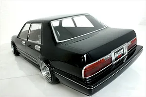 Rear-three-quarter view of a black Pandora RC Y31 Cedric Sedan body shell on a white studio background.