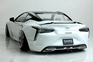 Rear three-quarter view of a painted white Pandora RC Lexus LC drift body shell on a reflective surface