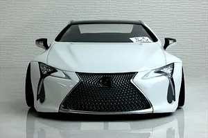 Front view of a white Pandora RC Lexus LC 7800 body shell showcasing the detailed spindle grille, headlights, and side mirrors.