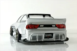 Rear view of a silver Pandora RC 180SX drift car body shell featuring a large spoiler and detailed rear bumper against a white background.