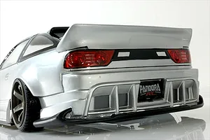 Rear three-quarter view of a silver Pandora RC 180SX drift car body shell showcasing rear diffuser, wing, and custom styling.