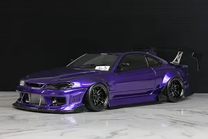 Custom painted purple Pandora RC S15 Silvia drift body shell mounted on a chassis with black wheels and a large rear wing.