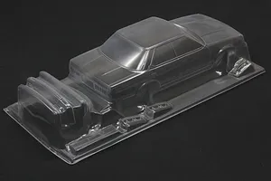 Unpainted clear polycarbonate RC car body shell for Toyota Mark 2 GX71 on a dark surface.