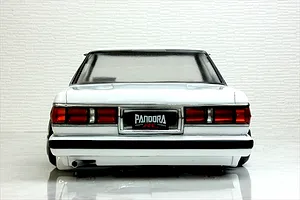 Rear view of the painted white Pandora RC Toyota Mark 2 GX71 body shell featuring taillights and a Pandora RC license plate.