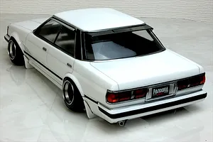 Rear high-angle view of a painted white Pandora RC Toyota Mark 2 GX71 RC body shell with black window trim and deep dish wheels.