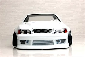 Front view of a white Toyota Chaser JZX100 RC drift car body shell with custom front bumper, wide fenders, and visible intercooler.