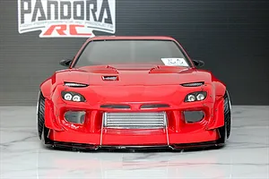 Front view of a red Pandora RC Mazda RX-7 FD3S drift car body shell featuring a wide body kit, front intercooler, and detailed headlights.