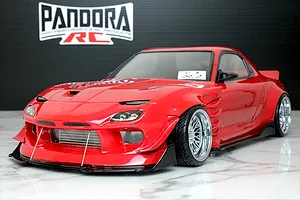 Red Pandora RC Mazda RX-7 FD3S RC drift car body shell on a marble surface with Pandora RC logo in the background.