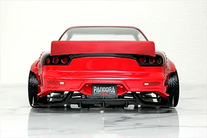 Rear view of a red Pandora RC Mazda RX-7 FD3S BN Sports drift car body on a reflective surface.