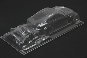 Unpainted clear polycarbonate RC car body shell for Toyota 86 ZN6 BN Sports shown on a black background.