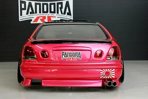 Rear view of a pink Pandora RC drift car body with dual exhaust pipes and Pandora RC branding.