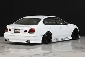 Rear-three-quarter view of a white Pandora RC Toyota Aristo JZS161 drift body shell mounted on an RC chassis with BN Sports decals.