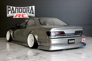Rear three-quarter view of a metallic grey Toyota Mark II RC drift car body shell with white wheels and Pandora RC branding.