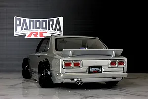 Rear view of a silver Pandora RC KPGC10 Skyline Hakosuka drift RC body shell with spoiler and black fender flares.
