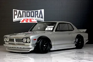 A silver Pandora RC KPGC10 Skyline GT-R Hakosuka RC drift car body mounted on a chassis with black wheels.