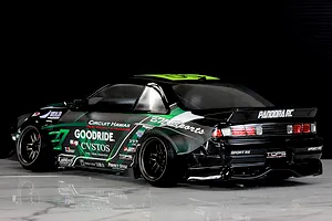 Side-rear view of a black Pandora RC S14 Silvia RC drift car with green and white BN Sports livery parked on a glossy surface.