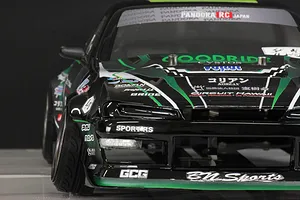 Close-up front angle of a black and green Pandora RC S14 Silvia RC drift car body featuring various sponsor decals.