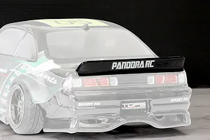 Close-up of the rear end of a Pandora RC S14 Silvia model car body showing the rear spoiler and decals.
