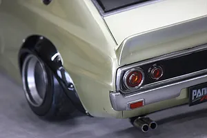 Close-up of the rear quarter section of a painted Pandora RC KPGC110 Skyline 2000GT-R model car body, showing tail lights and fender flare.