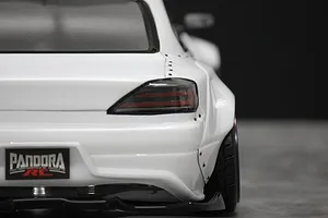 Close-up rear view of a white RC drift car body shell showing the rear fender flare, tail light, and Pandora RC license plate.