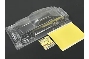Unpainted clear polycarbonate RC car body shell with separate decal sheet and window masking sheet on dark surface.