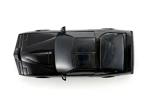 Top-down studio shot of the Kyosho Mini-Z Knight Rider RC car body in glossy black, showing hood details and tinted windows.