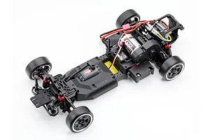 Top down studio shot of the unpainted chassis of the Kyosho Fazer D2 RC drift car without body shell on a white background.