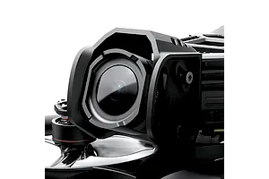 Close-up studio shot of the FPV drone's front camera housing and protective frame, highlighting the lens and mounting hardware.