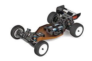 Top down studio shot of an assembled 1/10 scale 2WD electric RC buggy chassis featuring a brown aluminum tub chassis, electronics, and white wheels.