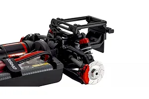 Close-up studio view of the rear chassis, suspension, shock absorbers, and brake disc details of the Kyosho Fazer MK2 RC car.