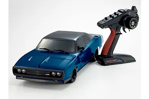 Kyosho 1970 Dodge Charger RC car in blue with black roof and its accompanying pistol grip transmitter on a white background.