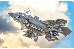 Painted plastic model kit of an F-35B Lightning II fighter aircraft in flight against a cloudy sky background.