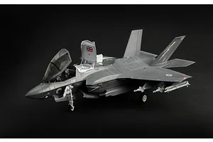 Completed Italeri 1/48 F-35B Lightning II plastic model aircraft with landing gear down and canopy open against a dark background.