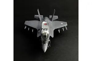Top front view of a completed and painted plastic model of an F-35B Lightning II fighter jet with British markings.