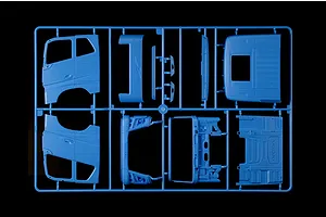 Blue plastic model kit sprue containing truck cab body parts and panels for the Italeri Volvo FH truck model.